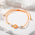 Cord and Pearl Accent Heart Evil Eye Bracelets in Nine Colors view 8