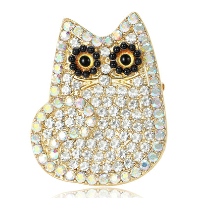 Front view of a rounded owl covered with clear or black crystals and gold eyes