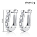 Silver Tone U Shaped Huggie Earrings With Three Clear Stones view 5