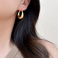 Polished Teardrop Hoop Earrings in Gold and Silver view 2