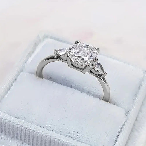 Silver-tone round center ring shown at an angle