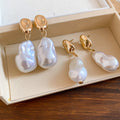 Gold Tone Baroque Pearl Drop Earrings With Polished Metal Details view 4
