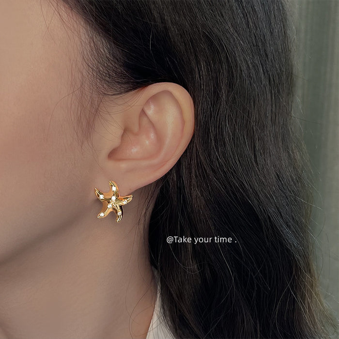 Gold-Tone Starfish Stud Earrings with Clear Crystal Accents