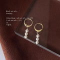 Gold Tone Huggie Hoop Earrings With Triple White Pearl Drop view 4