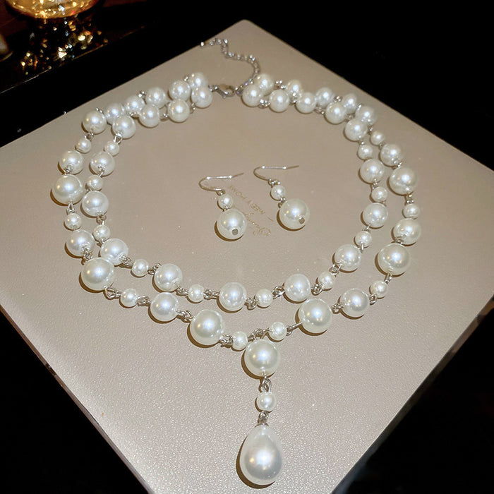 Silver Tone Double Strand Pearl Like Necklace And Drop Earring Set