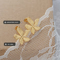 Gold Embossed Five Petal Flower Stud Earrings Pair view 2