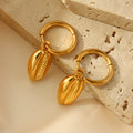 Gold Huggie Hoop Earrings with Cowrie Shell Dangle Charms view 4