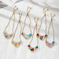 Gold Tone Pressed Flower Crystal Heart Slider Bracelets in Six Designs view 2