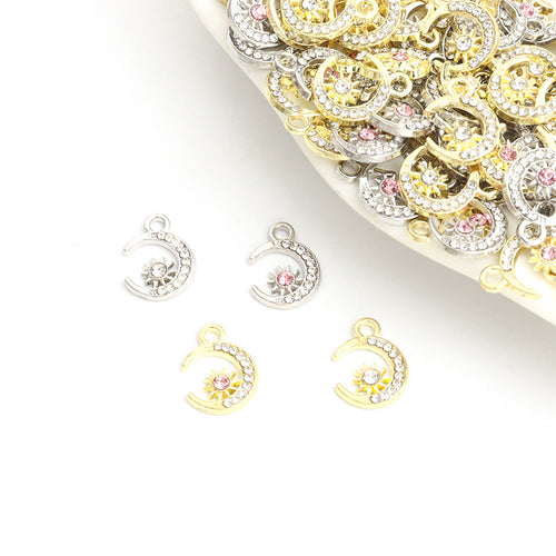 Front assortment of small crystal-lined moons with clear or pink stones