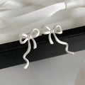 Wavy Bow Clip On Earrings in Silver and Gold Tone With Decorative Details view 4