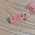 Pink Ceramic Rose Flower With Green Leaf Stud Earrings view 1