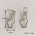 Outline Finger Heart Gesture Stud Earrings Four Metal Finishes view 4