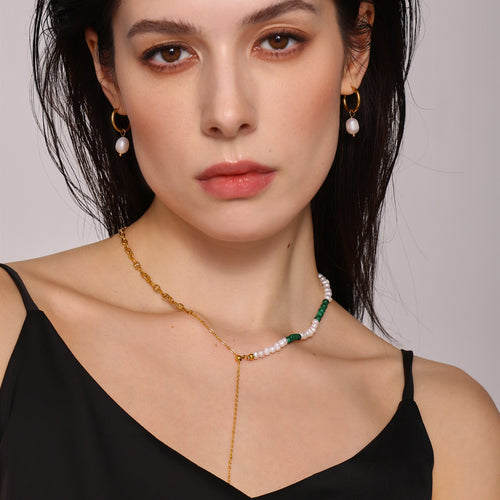 Model wears pearl turquoise Y necklace and pearl hoop earrings
