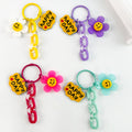 Smiley Daisy Charm Keychain with Acrylic Chain and Happy Day Tag view 1