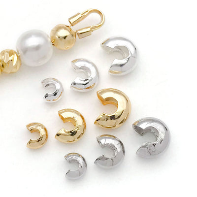 C shaped metal crimp covers in three sizes arranged as a full product overview