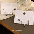 Two Mixed Earring Sets With Black Hearts Or Crystal Starbursts view 3