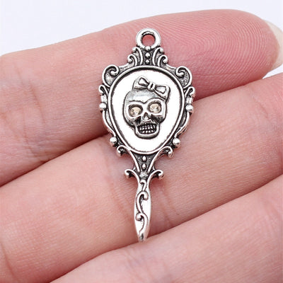 Skull Hand Mirror Charms in Silver and Red Enamel Styles shown in image 1, highlighting a skull face, ornate frame, bow 
