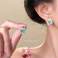 Gold Tone Green Square Center And Clear Petal Flower Stud Earrings view 2