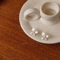 Gold Tone White Four Petal Flower Stud Earrings For Women view 3