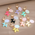 Gold Tone Balloon Dog Clip Keychains with Pearl Collars and English Tags view 1