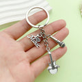 Guitar, Microphone and Saxophone Charm Keychains Featuring Red Guitar Across 11 Variations view 1