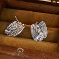 White Metal Swirl Baguette Stud Earrings Marquise Center view 3