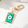 Gold Tone Wavy Rectangle Resin Evil Eye Clip Keychains in Six Colors view 8