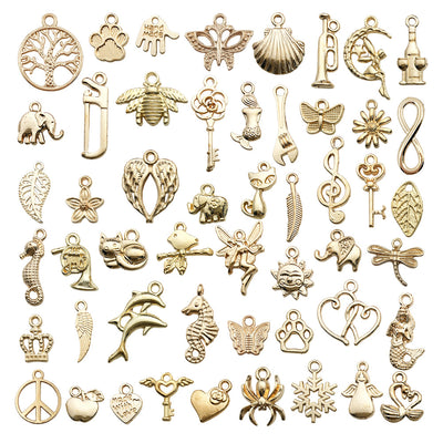 Yellow mermaid charms arranged on a light background