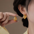 Twisted Open Hoop Earrings in Gold and Silver Tone view 2