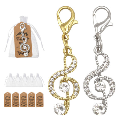 Gold and silver rhinestone treble clef charms with bags and tags