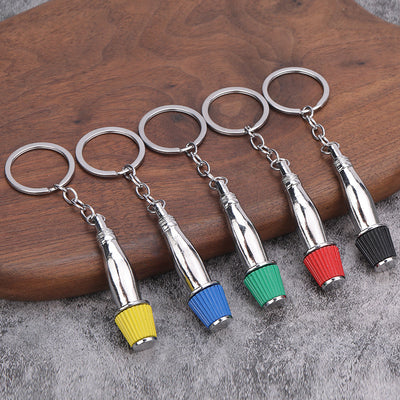 Five silver-tone cone air filter keychains with yellow, blue, green, red, and black ribbed ends.