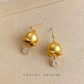 Matte Gold Bell Flower Drop Earrings Clear Teardrop CZ view 4