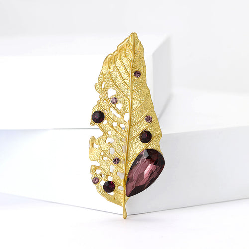 Alternate finish view of textured leaf with small stones and a large colored beetle body accent