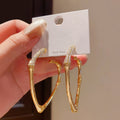 Gold Tone Slender Angular Bamboo Style Hoop Earrings view 3
