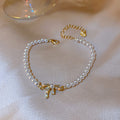 White Pearl Bracelet With Gold Tone Crystal Bow Center view 6
