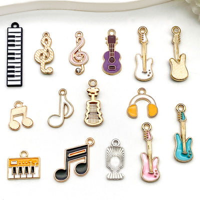 Colorful musical instrument and guitar charms shown in a close-up product view
