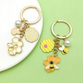 Bee and Honeycomb Charm Keychains Featuring Yellow Sunflower Across 33 Pictured Variations view 3