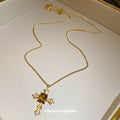 Gold Tone Cross Pendant Necklace With Brown Cabochon Center view 4