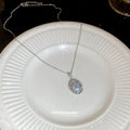 Silver Tone Oval Crystal Halo Pendant Necklace with Detailed Finish view 4