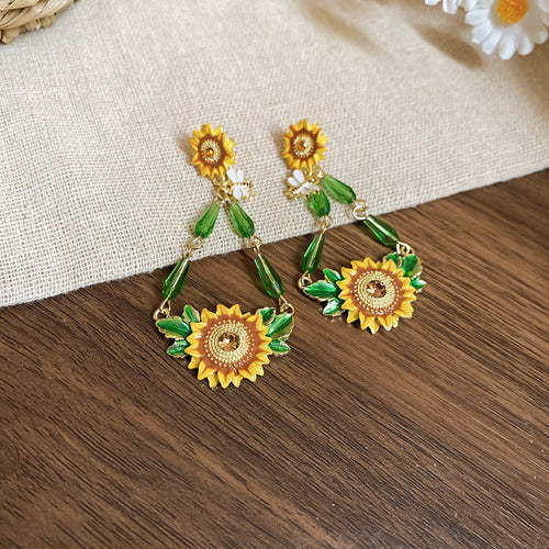 matching long yellow sunflower drop earrings displayed as a pair
