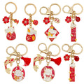 Cat Charm Keychains Featuring Red Blossom Across 17 Pictured Variations view 5