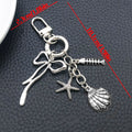 Three Silver Tone Bow Shell and Starfish Clasp Keychains view 6
