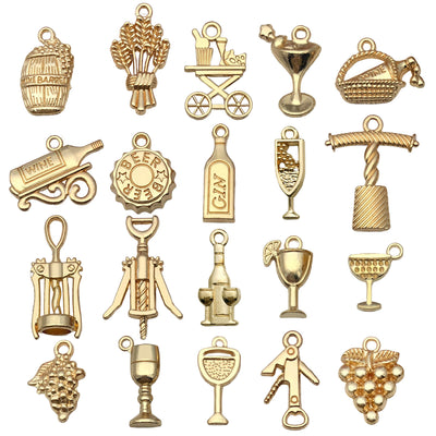 Gold-tone assorted shape charms arranged on a light background