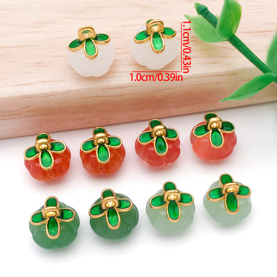 Front product photo of multi-color glass pumpkin charm showing the pictured design arrangement
