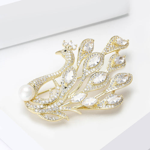 Side angle gold peacock brooch fanned tail feathers