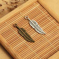 Slim Feather Metal Charm Pendant in 3 Finishes for Jewelry Making view 1
