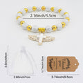 White And Gold Tone Cross Bead Bracelet With Winged Cross Charm view 4