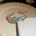 Gold Tone Stacked Crystal Bracelet Sets In Clear Blue Or Pink view 1