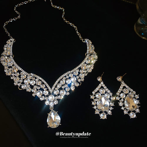 silver-tone floral leaf V crystal necklace and teardrop earring set shown in the first close product view