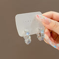 Silver Tone Opalescent Oval Cluster Compact Huggie Earrings view 1